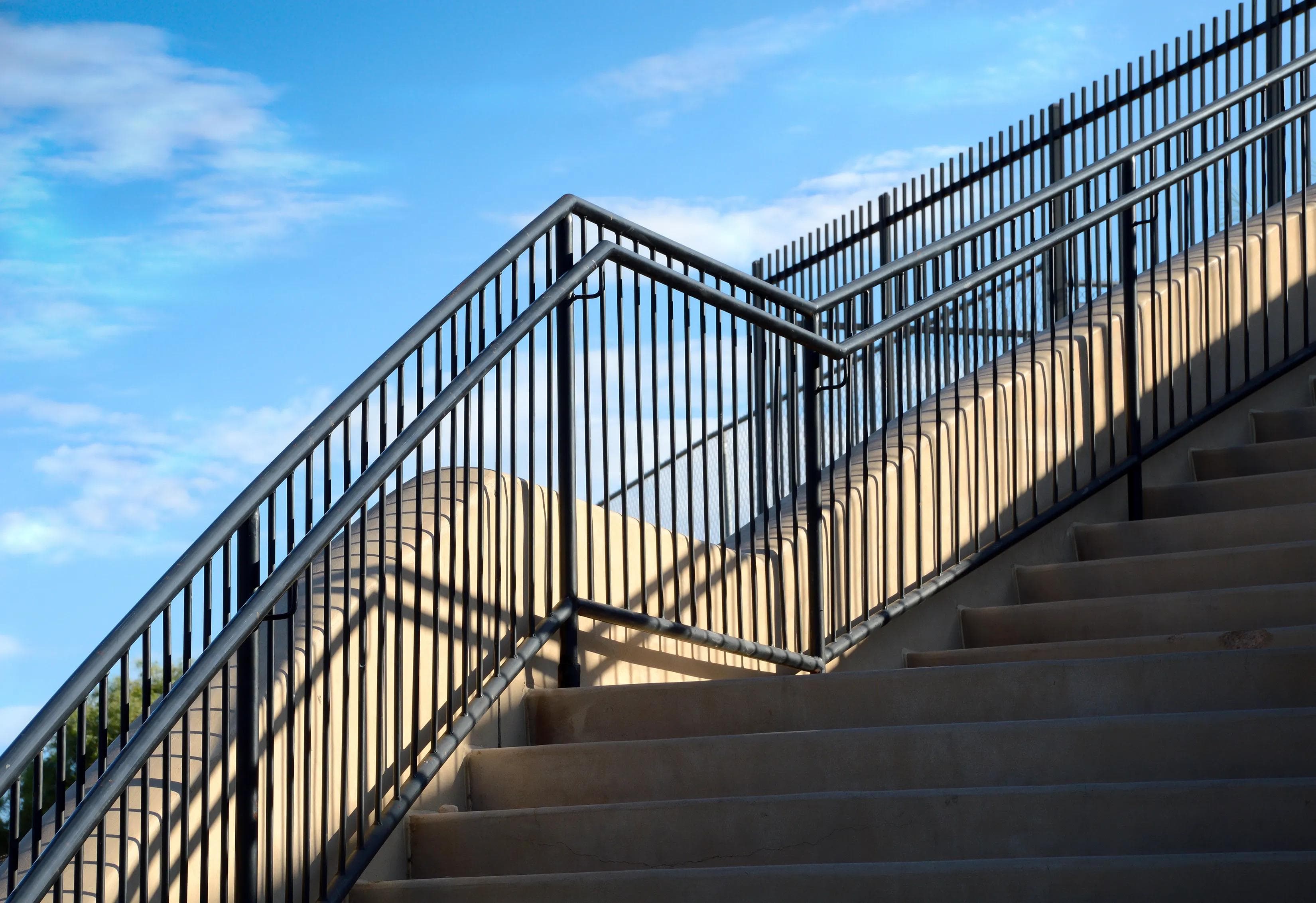 New steel railing installation on a front porch in Chicago by AGGO Pro Construction & Engineering